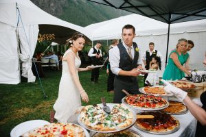 Serving Pizzas For Guests At a Wedding event organized by Event Management Company Kiyoh