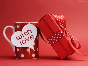 Image that resembles a Bright Red Colored Cup with a Beautiful Red Color Wrapped Gift with a note of with love.